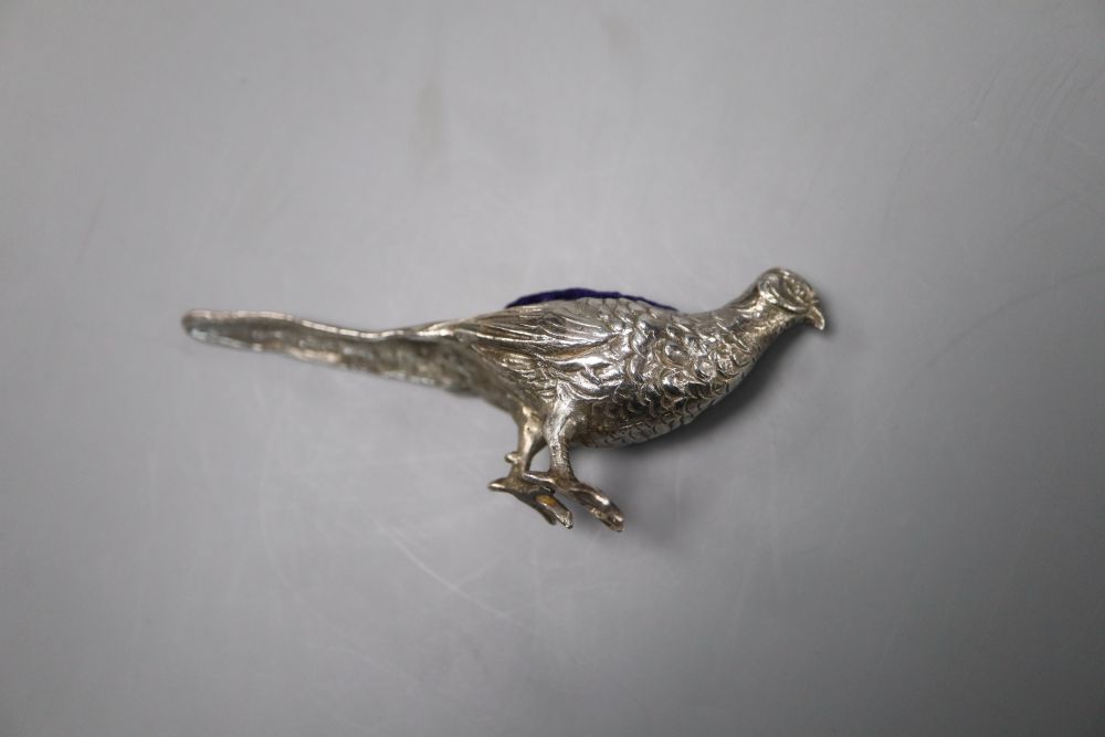 An Edwardian novelty silver pin cushion, modelled as a pheasant, import marks for Glasgow, 1907, 84mm.